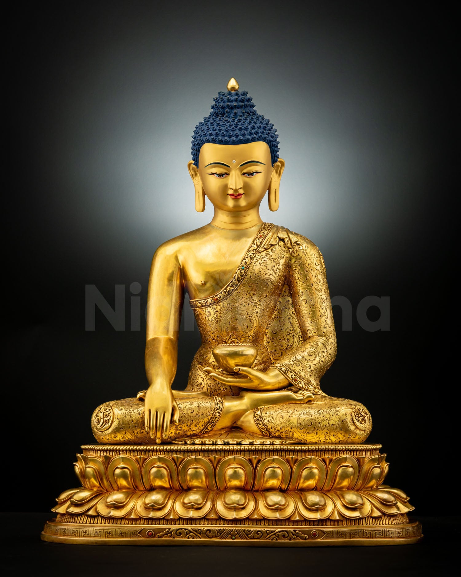 Front view of Shakyamuni Buddha Statue handcrafted in copper with gold fire-gilding, seated on double lotus pedestal with earth-touching mudra.