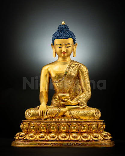 Front view of Shakyamuni Buddha Statue handcrafted in copper with gold fire-gilding, seated on double lotus pedestal with earth-touching mudra.