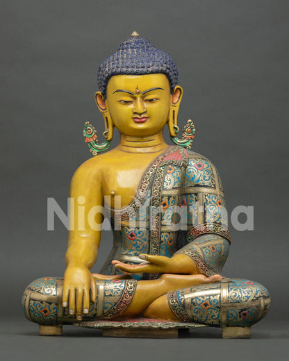 Front view of Shakyamuni Buddha statue, handcrafted in copper with vibrant hand painted details from Nepal