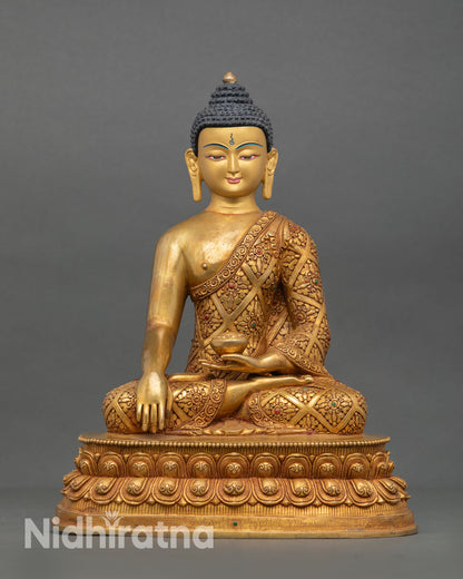 Front view of Shakyamuni Buddha statue handcrafted in Nepal with copper alloy body gold fire gilding, hand painted face and double lotus pedestal 