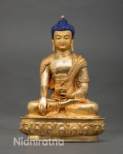 Front view of Shakyamuni Buddha statue handmade Nepal copper with 24K gold fire gilded finish and gold painted face for meditation altar decor
