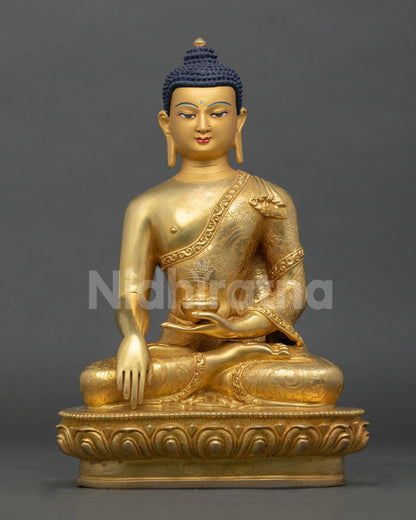 Front view of Shakyamuni Buddha statue seated on lotus pedestal with gold-painted face and copper gold fire gilding.