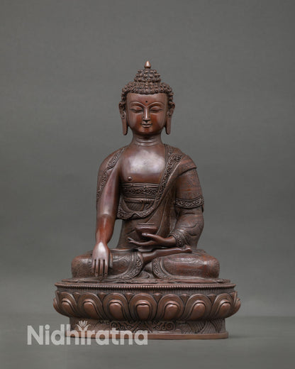Front view of Shakyamuni Buddha statue  with oxidized copper finish, Bhumisparsha Mudra symbolizing enlightenment and spiritual awakening