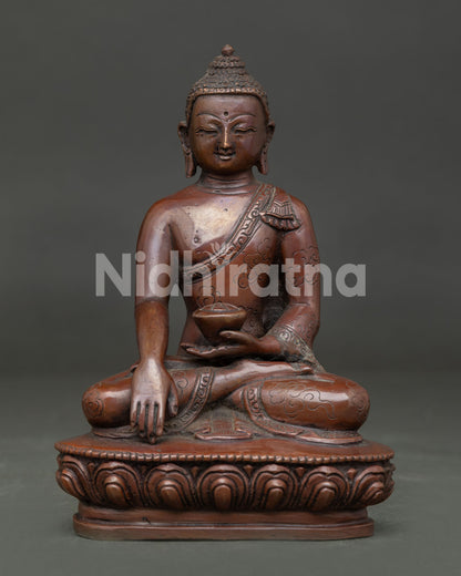 Front view of Shakyamuni Buddha Statue with oxidized copper finish seated on lotus pedestal.