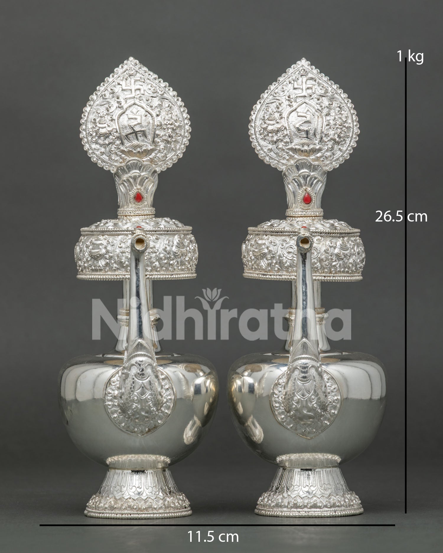 Front View of Silver Buddhist Bhumba Set with Ornate Teardrop Finial and Red Stone – Handcrafted in Nepal