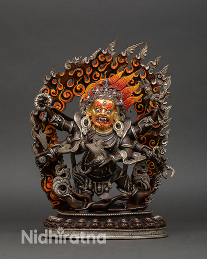 Front view of Six-Armed Mahakala statue, handcrafted in Nepal from copper with oxidized and silver-plated finish, Buddhist protector deity