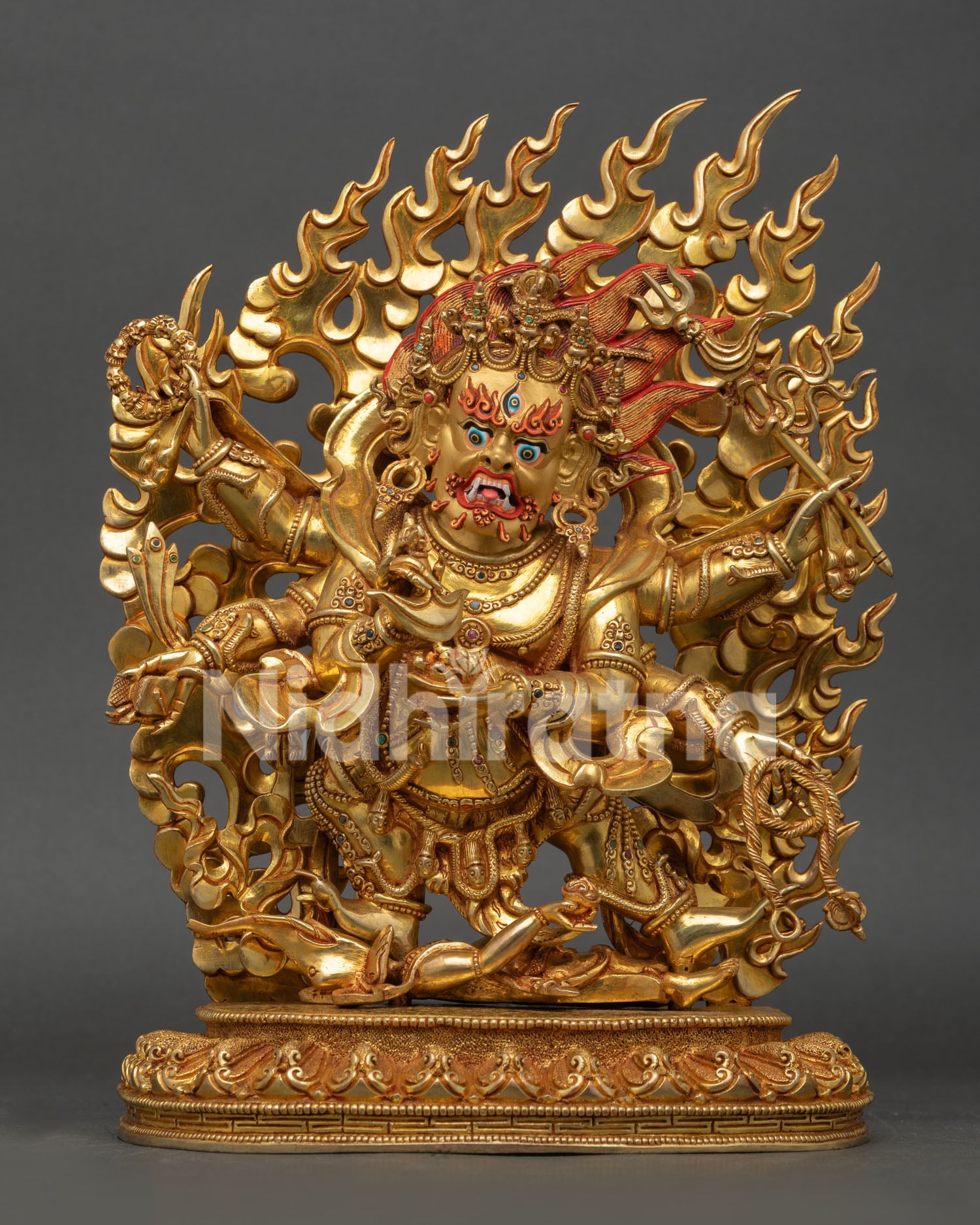 Front view of Six-Armed Mahakala statue standing on lotus pedestal with flaming halo from Nepal