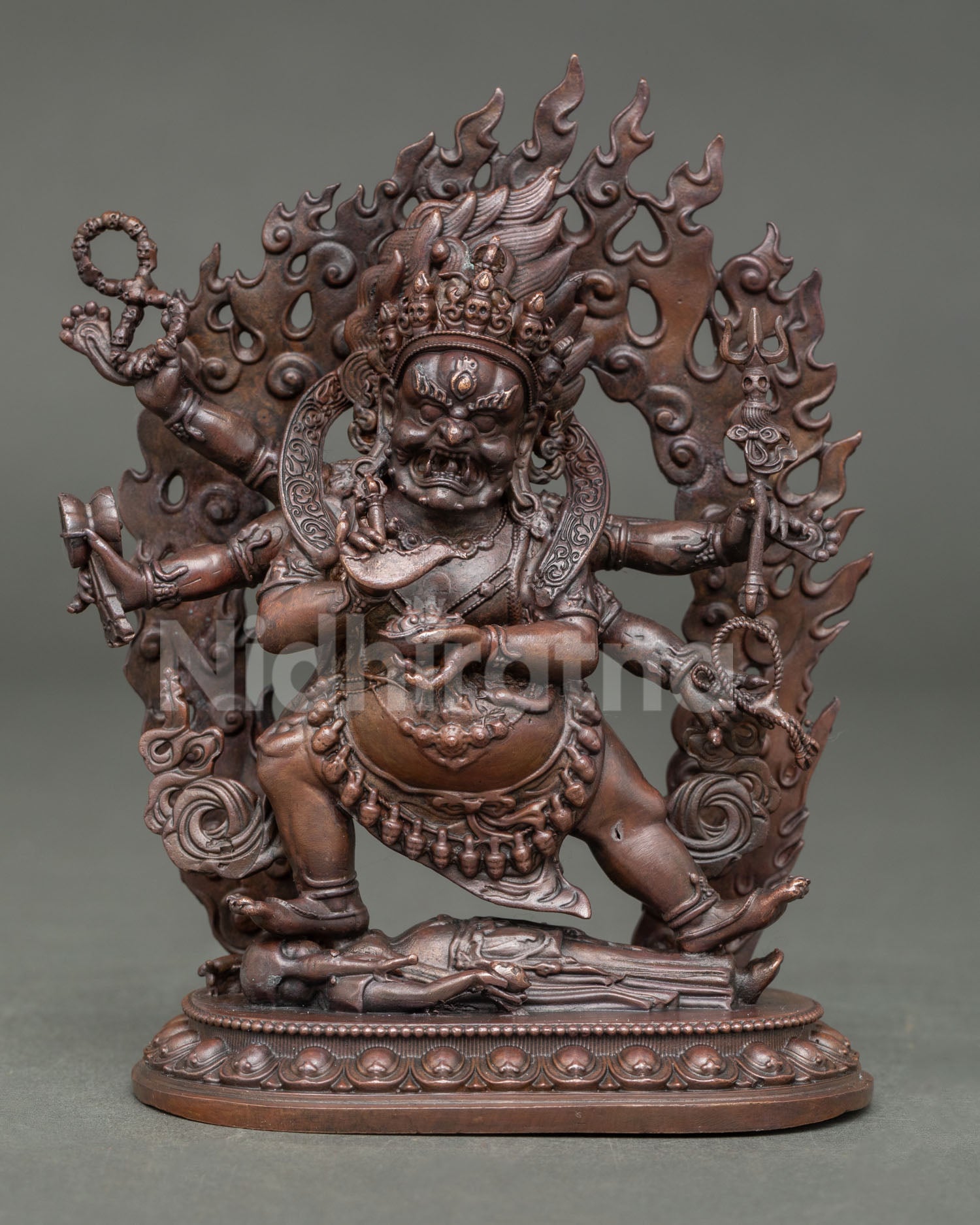 Front view of Six Armed Mahakala statue with wisdom flames and lotus pedestal from Nepal