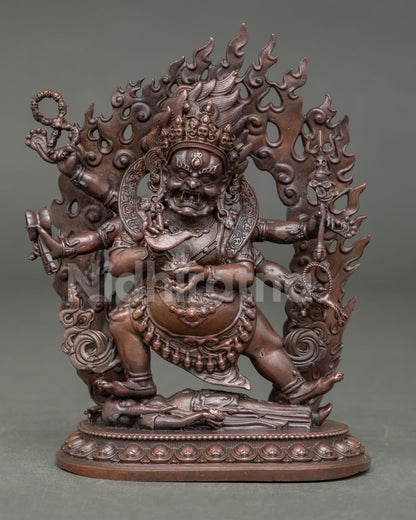 Front view of Six Armed Mahakala statue with wisdom flames and lotus pedestal from Nepal