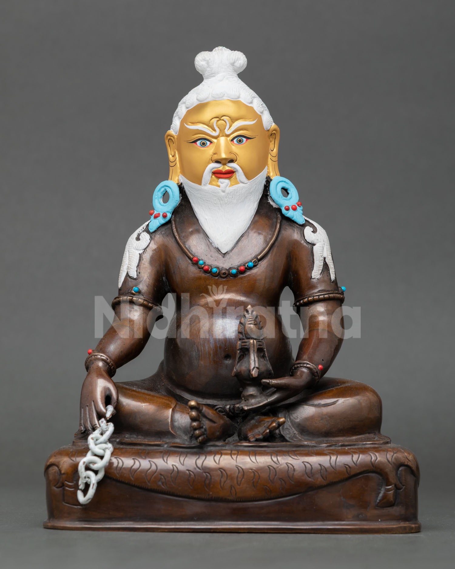 Front view of Thangtong Gyalpo oxidized copper Buddhist statue with gold-painted face