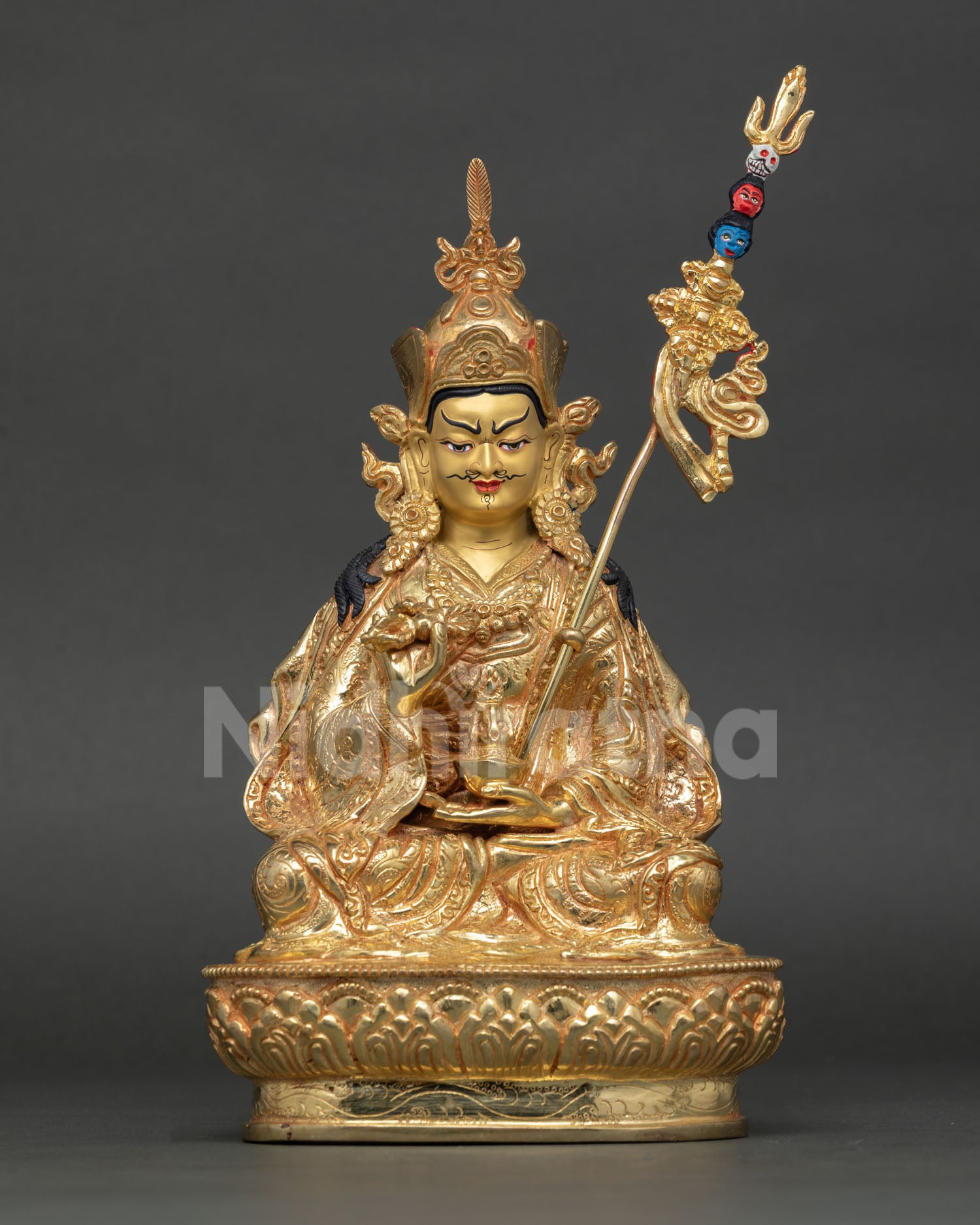 Front view of Tsokye Dorje statue, lotus born vajra master, handcrafted in copper with 24k gold detailing and gold painted face