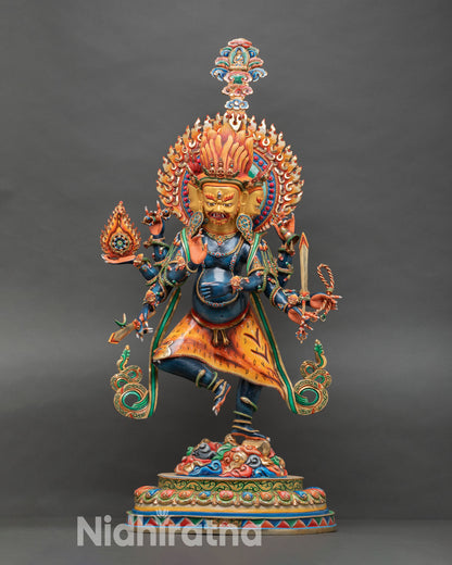 Front view of Ucchusma statue handcrafted in Nepal using lost wax technique with vivid blue body, gold gilded faces, and multi colored lotus pedestal