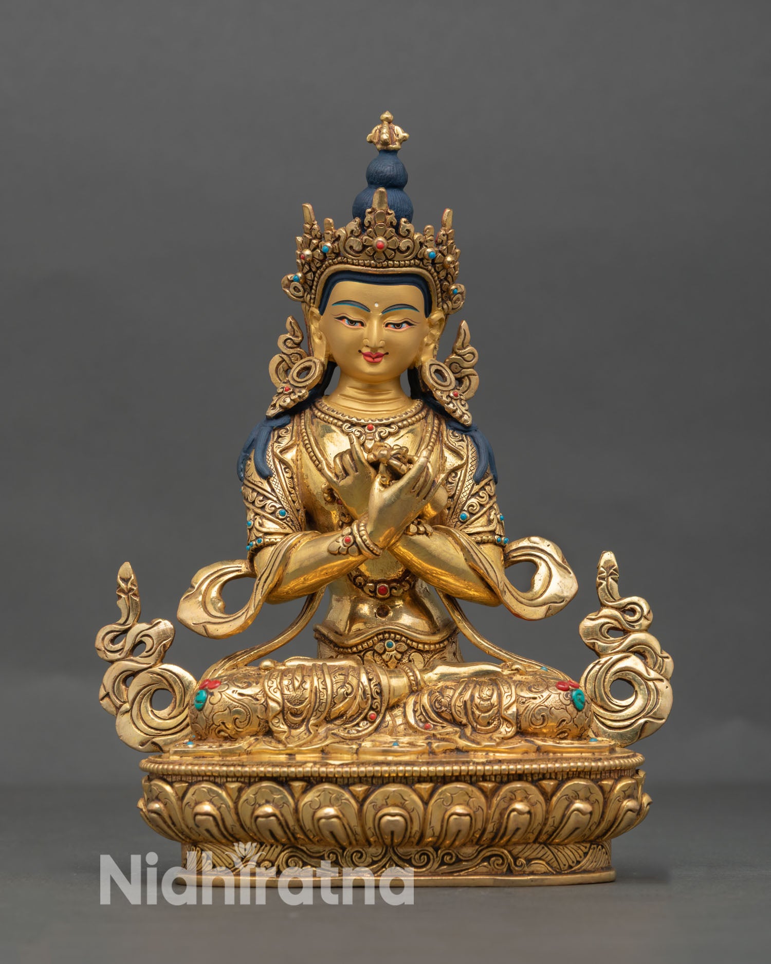 Front view of Vajradhara statue handcrafted in Nepal in 24K gold gilded copper with semi precious stone inlays