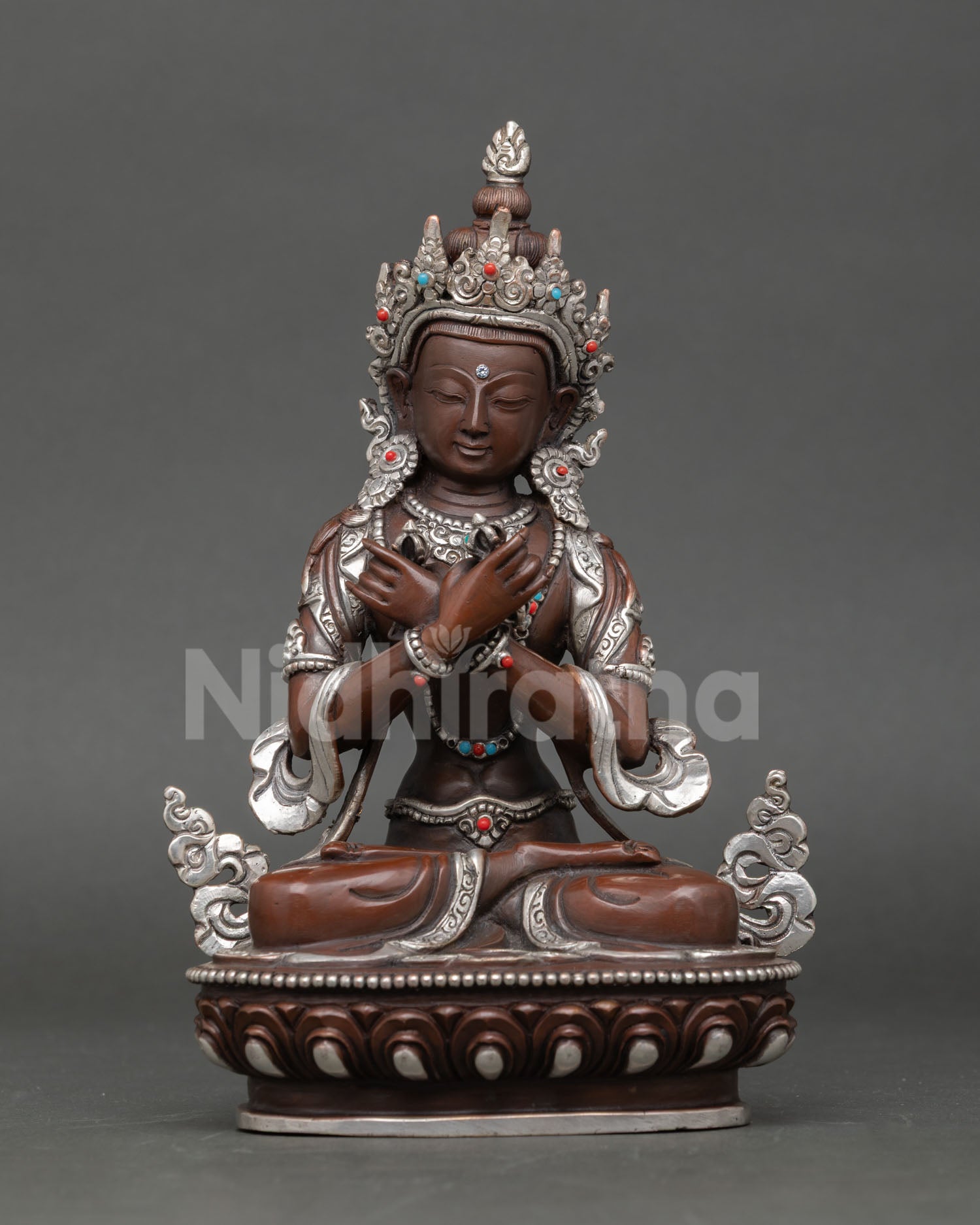 Front view of Vajradhara statue handmade in copper with oxidized and silver plated finish from Nepal 