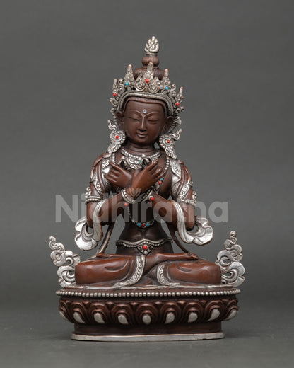 Front view of Vajradhara statue handmade in copper with oxidized and silver plated finish from Nepal 