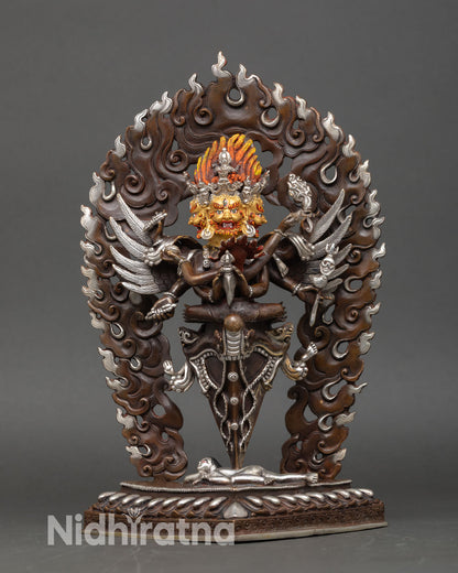 Front view of Vajrakilaya statue in oxidized copper with silver plating from Nepal, a Himalayan wrathful deity.