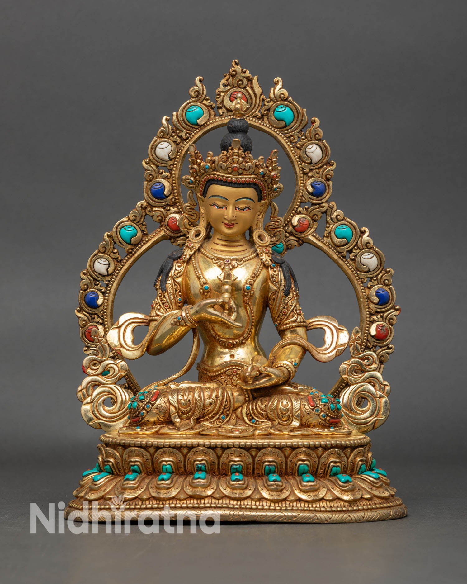 Front view of Vajrasattva statue, handcrafted from copper with gold on a lotus pedestal, representing karmic purification.