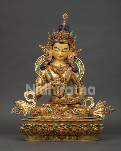 Front view of Vajrasattva statue handcrafted in Nepal with 24K gold gilding semi precious stones and lotus pedestal
