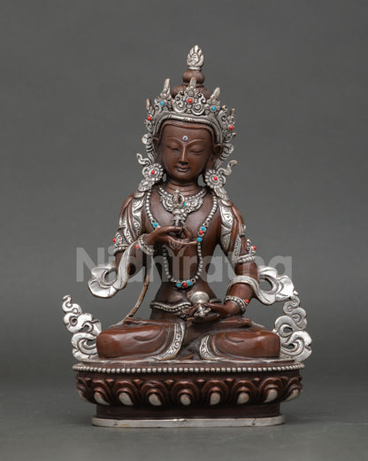 Front view of Vajrasattva statue handmade in copper with silver plated finish from Nepal