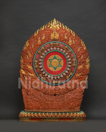 Front view of Vajrayogini statue's flame halo with pentagon mandala and skulls