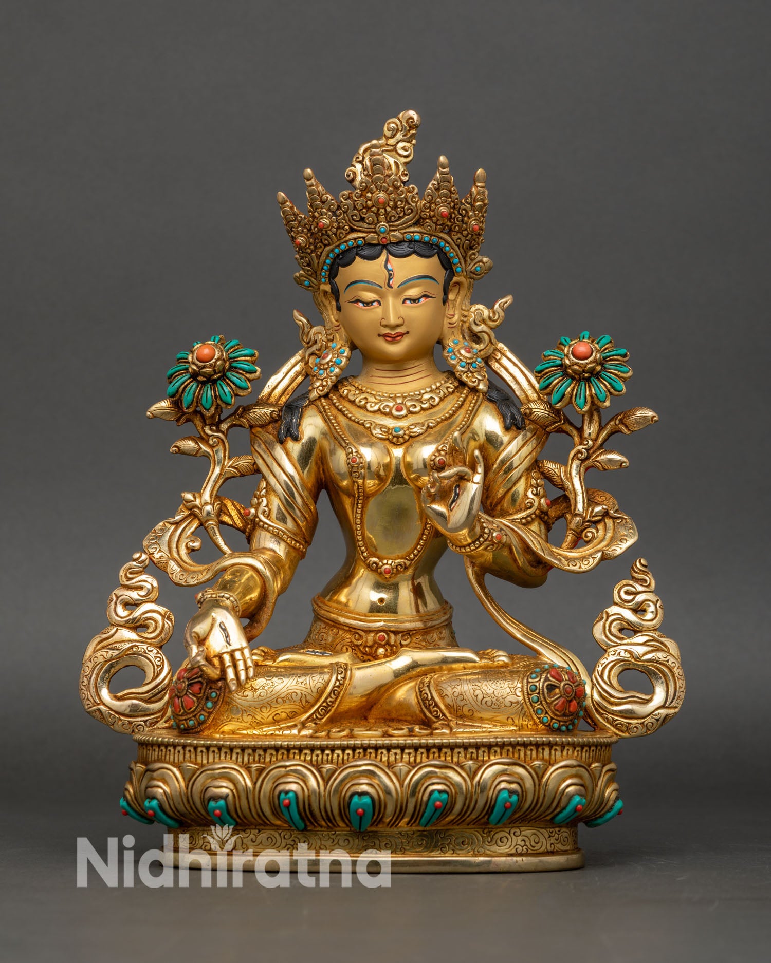 Front view of White Tara statue handcrafted from copper and gold gilded by Newari artisans in Nepal
