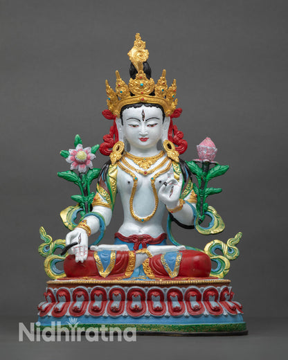 Front view of White Tara statue handcrafted in copper using lost-wax method with hand-painted details and lotus pedestal.