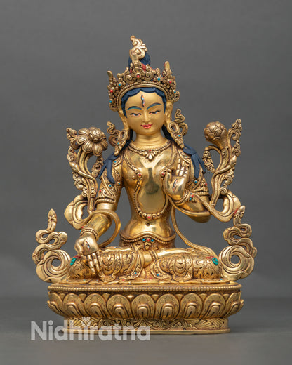 Front view of White Tara statue, handmade in Nepal with gold gilded copper, lotus pedestal