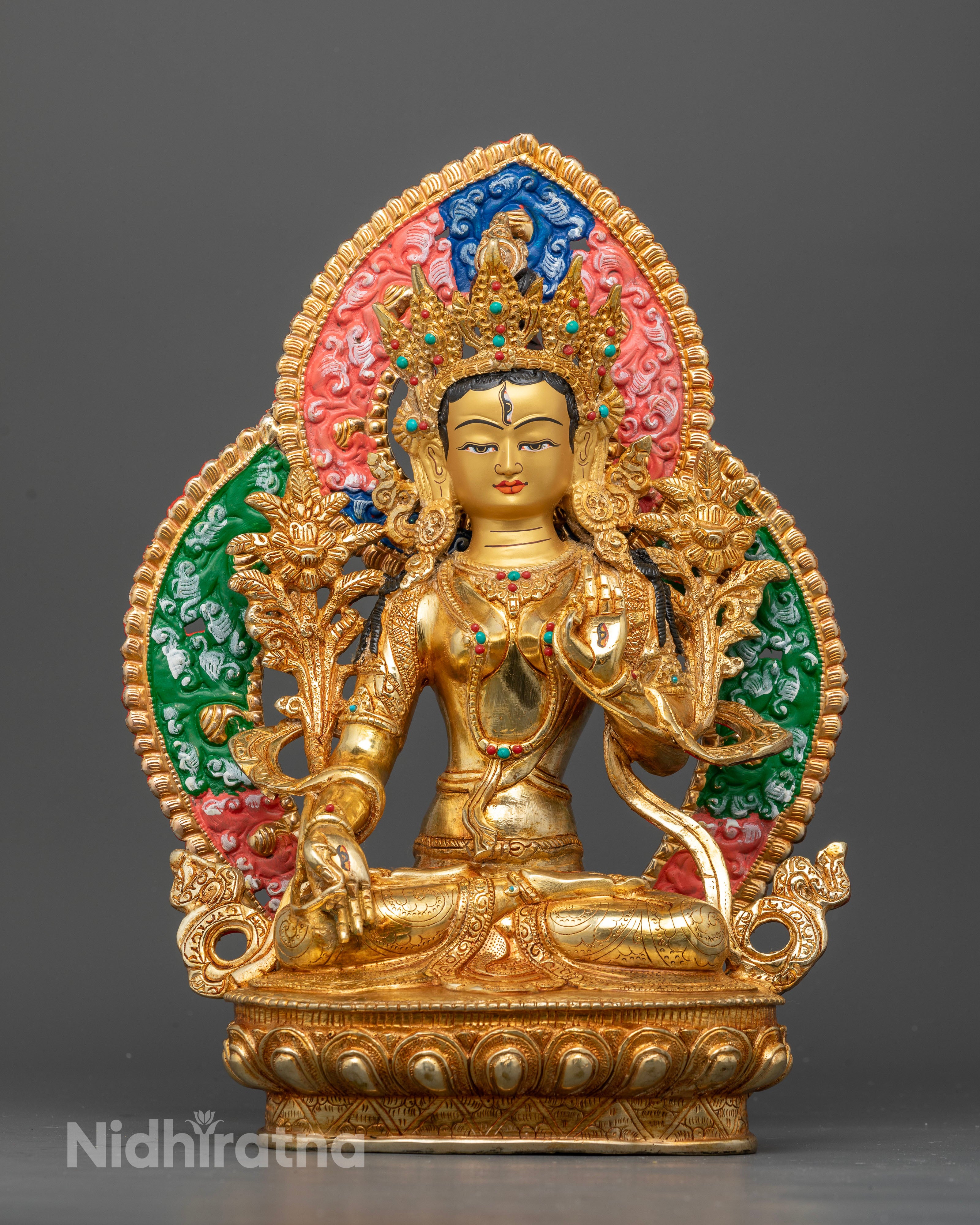 Front view of White Tara statue with seven eyes and 24K gold fire gilded copper