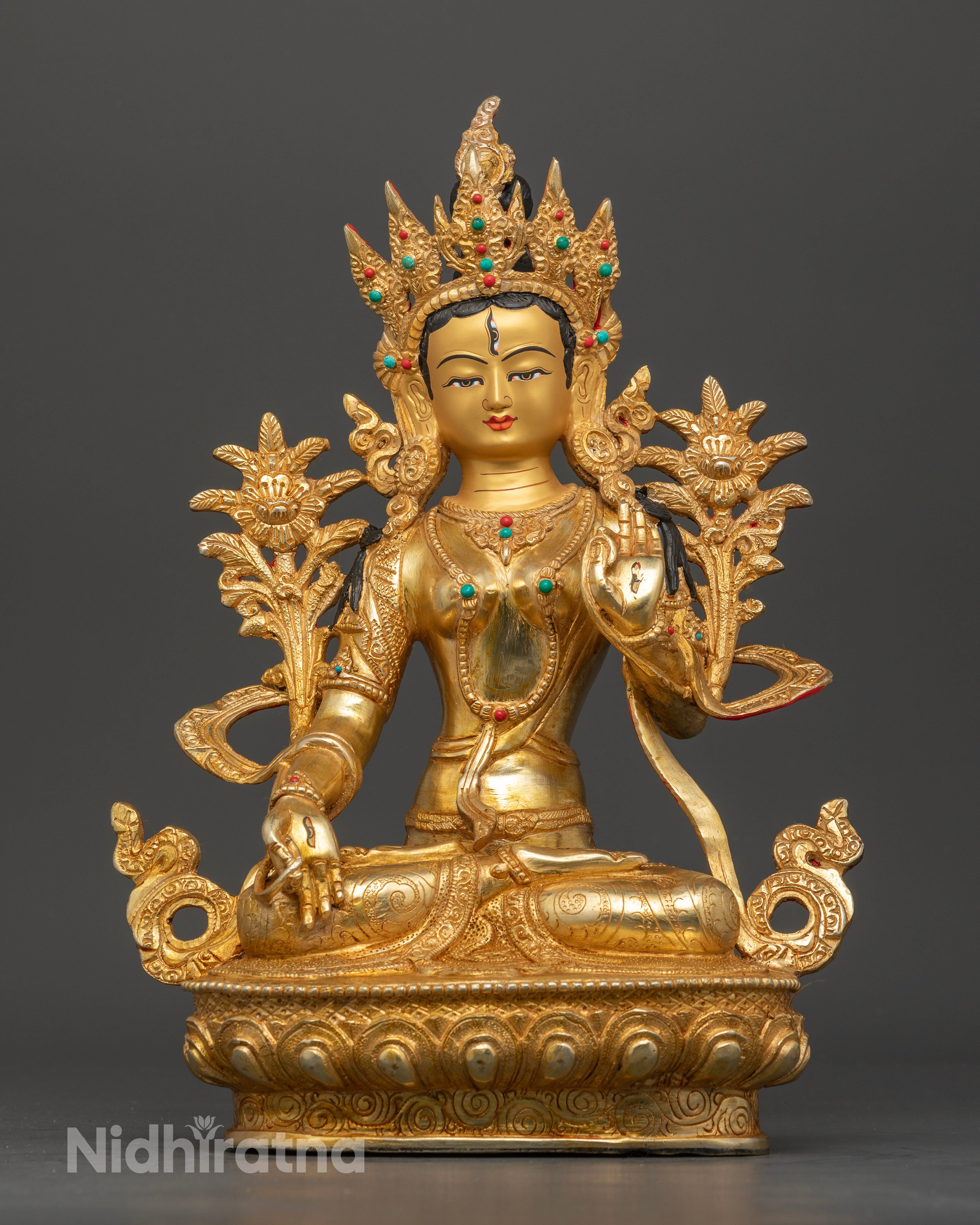 Front view of White Tara statue with seven eyes and five jeweled crown