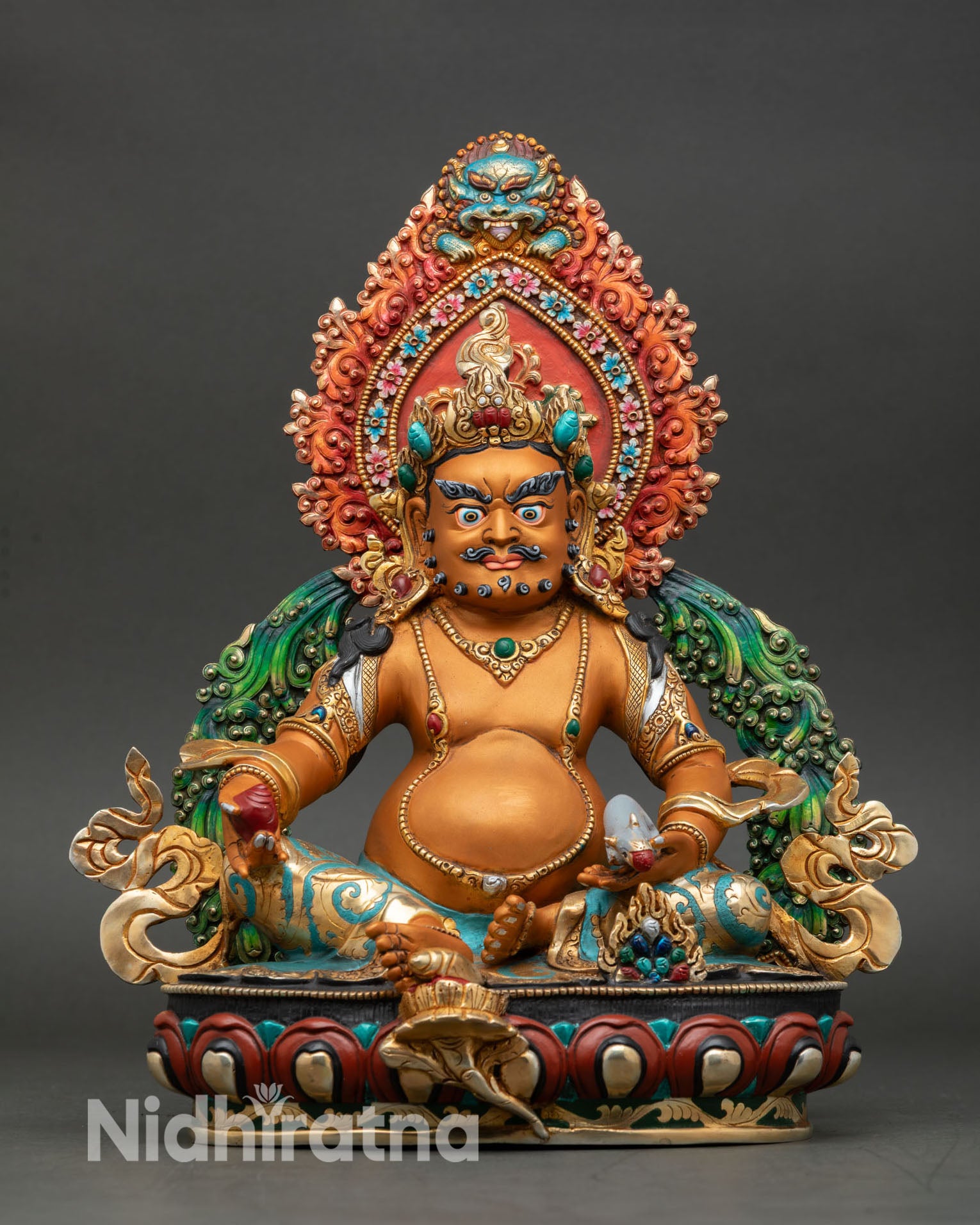 front view of yellow dzambhala statue copper gold gilded wealth deity on lotus base nepalese buddhist sculpture