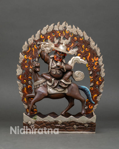 Front view of Pehar Gyalpo statue handmade copper Buddhist protector deity from Nepal oxidized silver plated finish lost wax technique horse riding