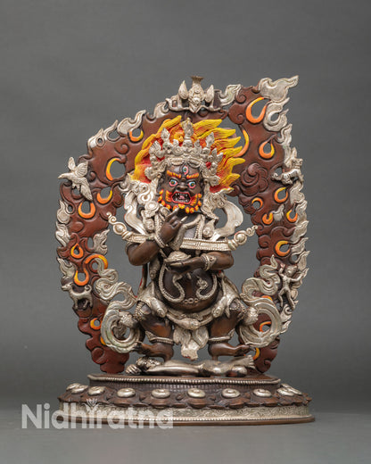 Front view of Sakya Mahakala statue handcrafted in oxidized copper and silver, wrathful protector deity.