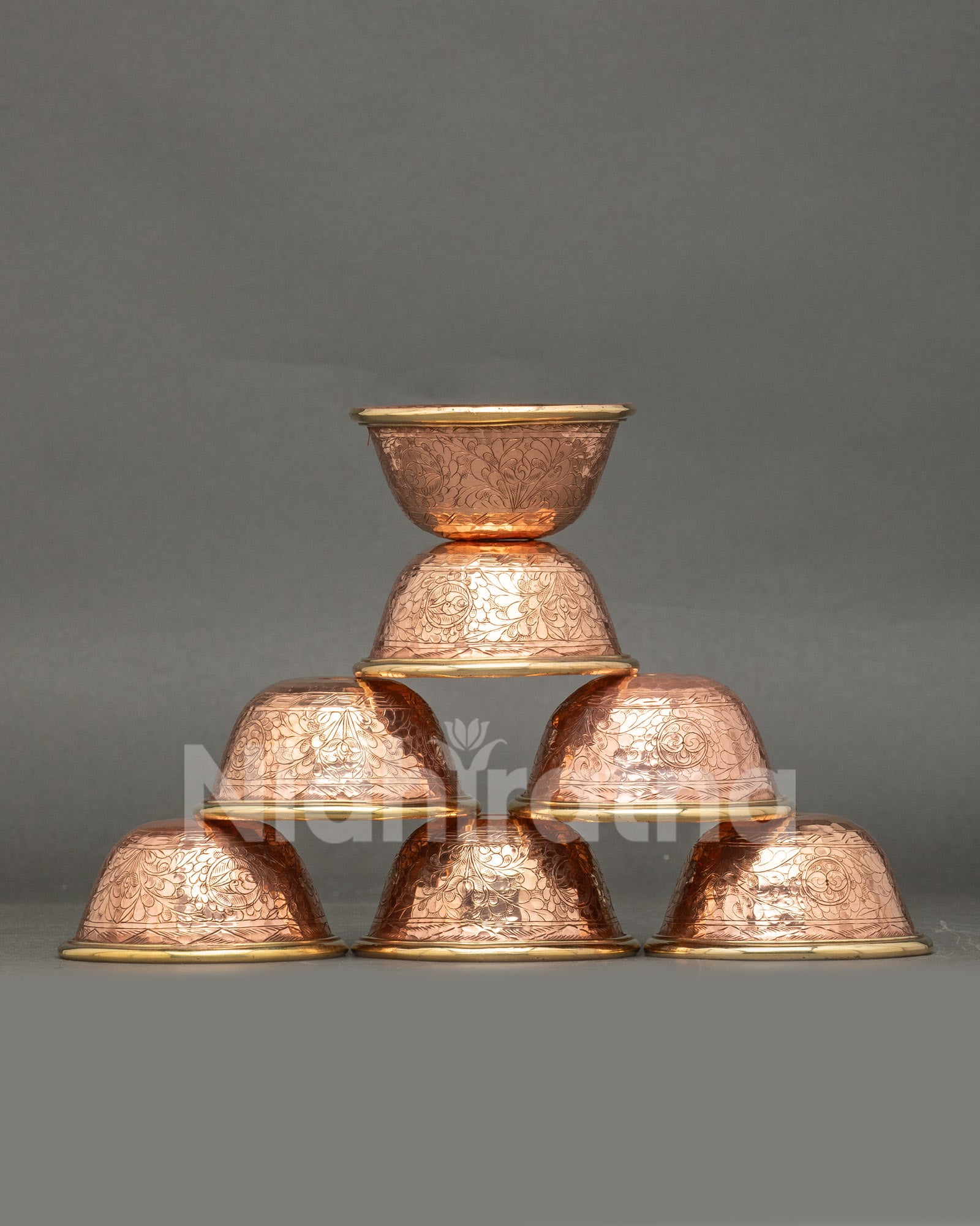 Front view seven water offering bowls handcrafted copper Tibetan altar set