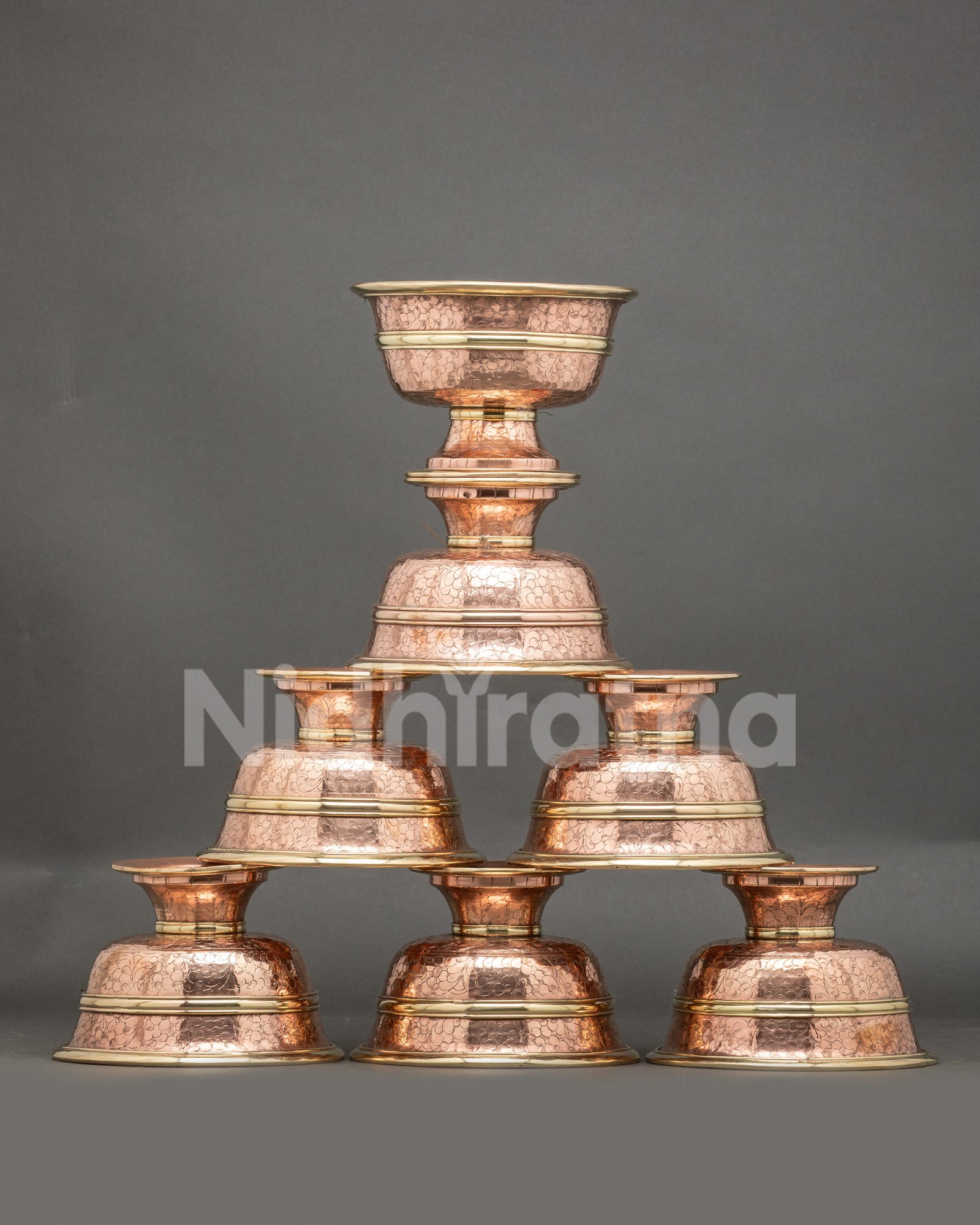 Front view seven water offering bowls handcrafted copper Tibetan altar set