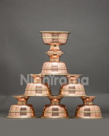 Front view seven water offering bowls handcrafted copper Tibetan altar set