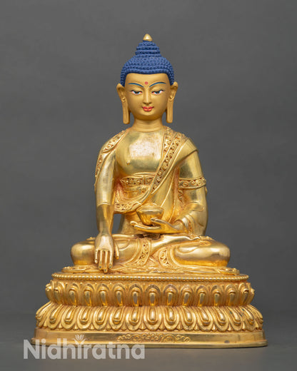 Front view of Shakyamuni Buddha statue, copper alloy gold fire gilded finish, seated lotus pedestal earth witness mudra, Nepal handcrafted sculpture