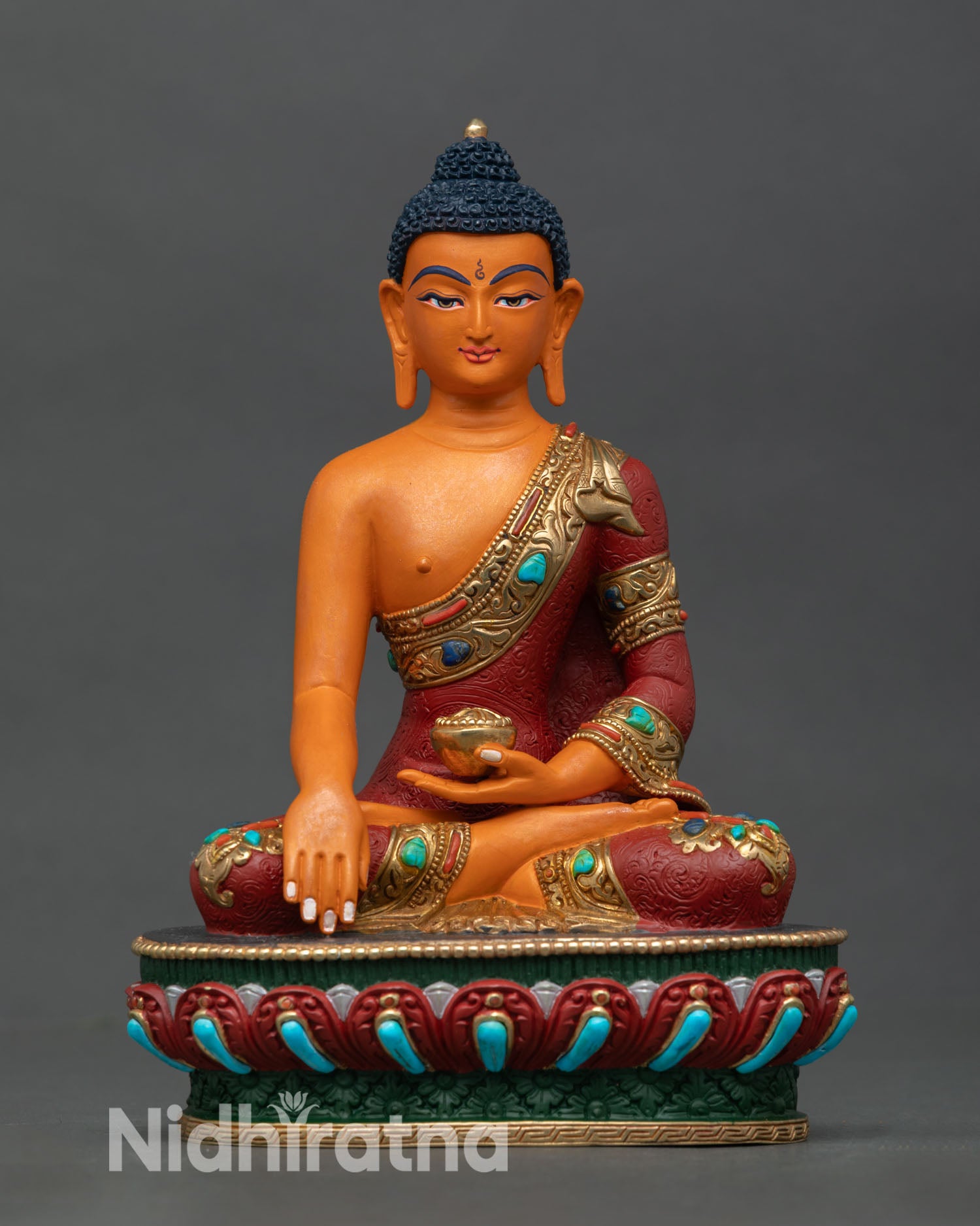 Front view of Shakyamuni Buddha statue copper Buddhist sculpture Nepal handcrafted Newari artisan gold gilded accents lotus pedestal altar decor