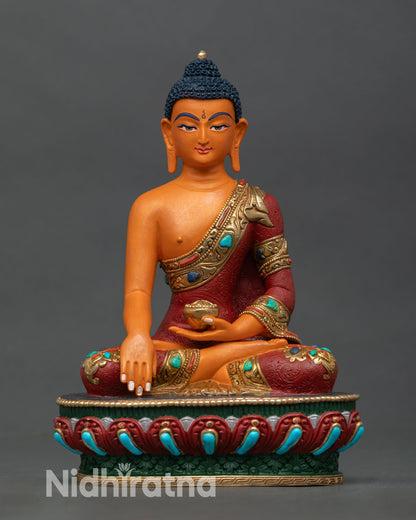 Front view of Shakyamuni Buddha statue copper Buddhist sculpture Nepal handcrafted Newari artisan gold gilded accents lotus pedestal altar decor