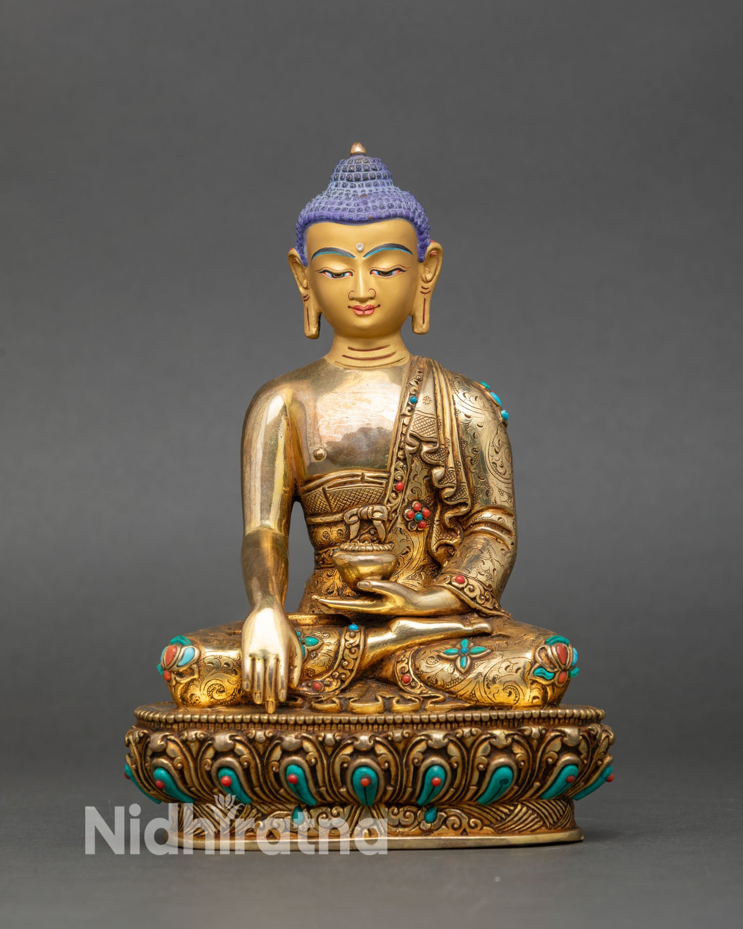 Front view of Shakyamuni Buddha statue gold fire-gilded copper semi-precious stones Nepal