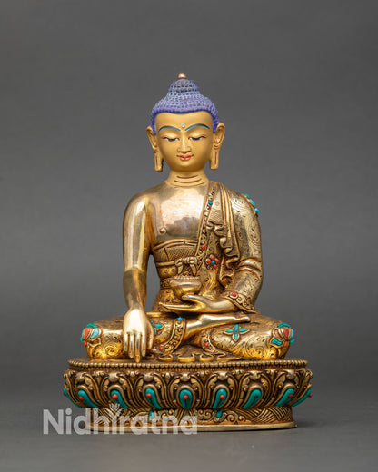 Front view of Shakyamuni Buddha statue gold fire-gilded copper semi-precious stones Nepal