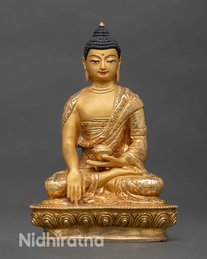 Front view of Shakyamuni Buddha statue handcrafted in copper with gold gilded finish seated on lotus pedestal showing earth touching mudra