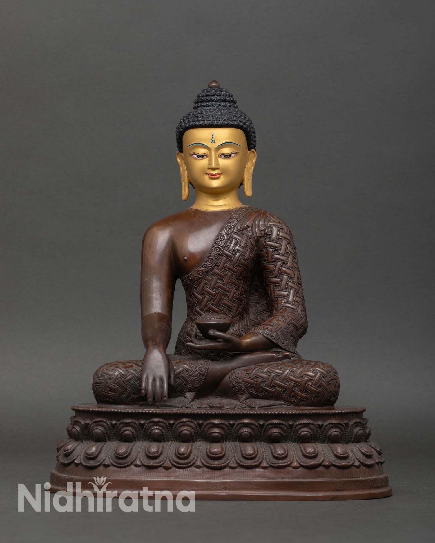Front view of Shakyamuni Buddha statue, oxidized copper, gold-painted face, Newari artisan meditation sculpture