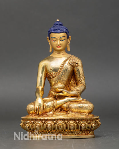 Front view Shakyamuni Buddha statue seated on lotus copper with gold gilding and patra bowl