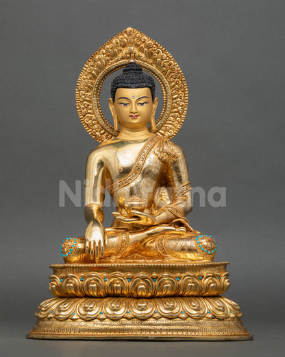 Front view of Shakyamuni Buddha statue with gold fire gilding and lotus throne