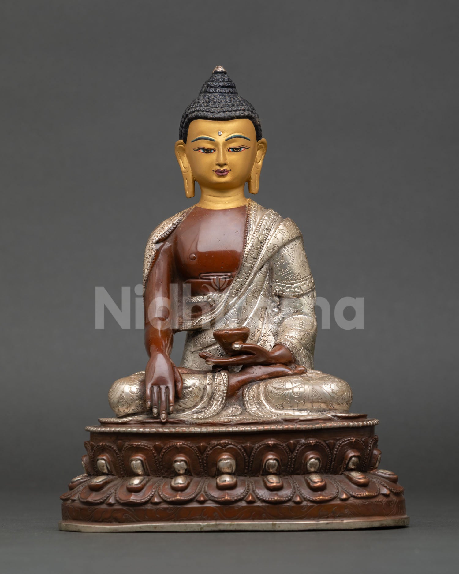 Front view of Shakyamuni Buddha statue with oxidized silver plated copper finish
