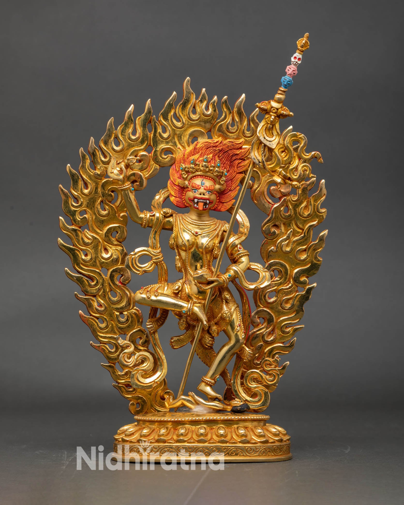 Front view Simha Mukha lion faced deity statue gold gilded copper Nepalese art