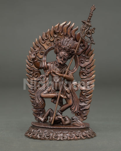 Front view of Simhamukha statue Lion-Faced Dakini handmade in copper with oxidized finish standing on subdued figure
