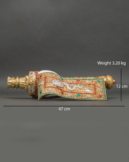 Front view of Tibetan conch shell ritual instrument copper gold and silver plated Buddhist ceremonial object Nepal handcrafted Newari artisan