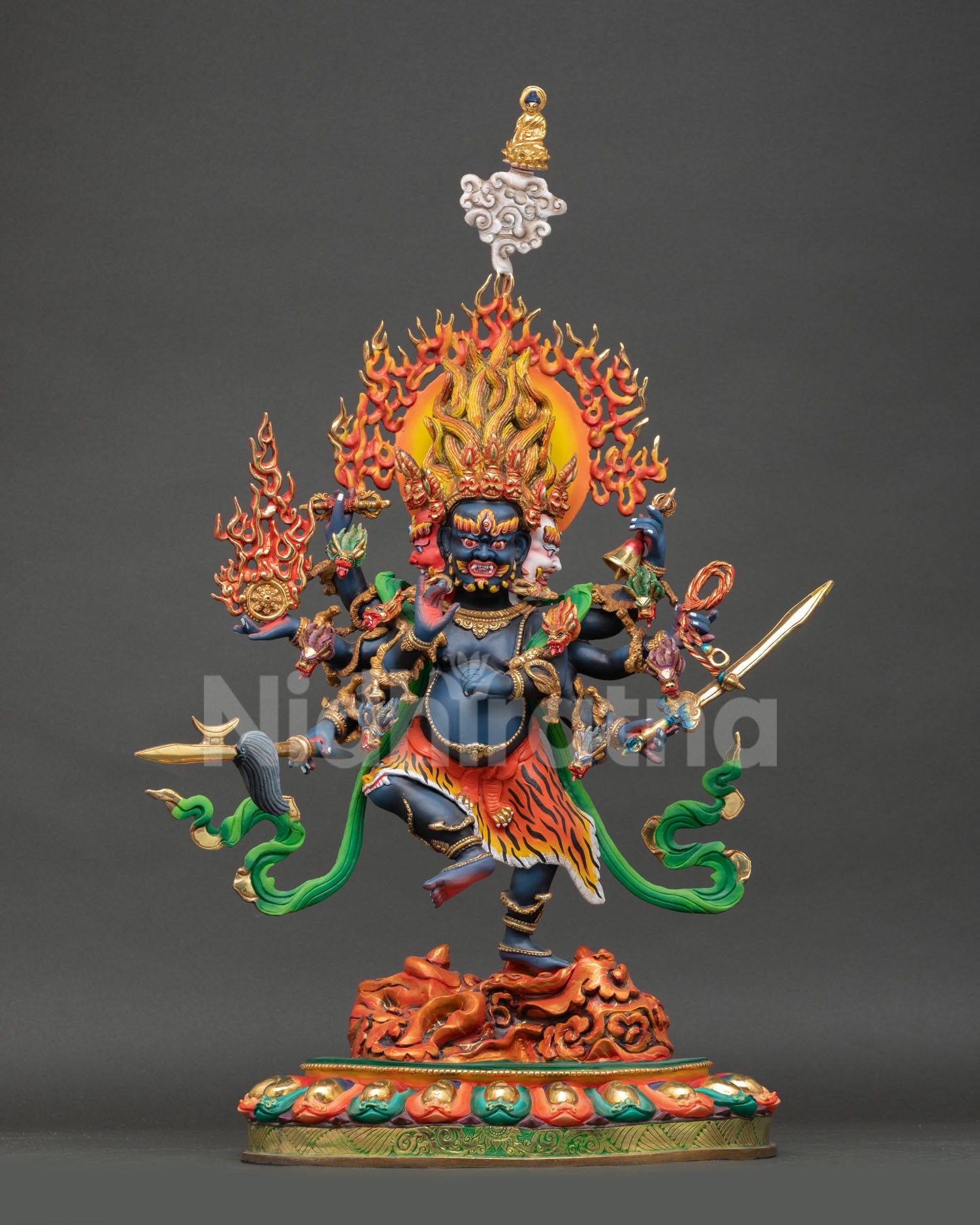 Front view of Ucchusma statue wrathful purification deity handcrafted in Nepal copper with deep blue body and flaming halo for Buddhist altar