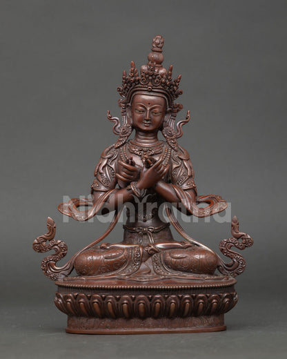 Front view of Vajradhara statue handcrafted in oxidized copper with crossed arm posture vajra and bell for Buddhist altar and meditation decor.